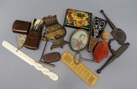 A box of assorted curios including a Russian papier mache box, a Roman nail and four pairs of