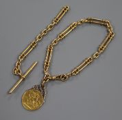 An 18ct gold bracelet (ex albert), hung with a George V full sovereign, with spare albert section.
