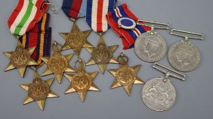 Ten assorted WWII medals etc. inc. box and paperwork.