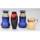 A pair of Doulton vases, a flambe vase and a silver mounted stoneware mug tallest 21.5cm