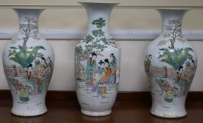 A pair of vases and one other