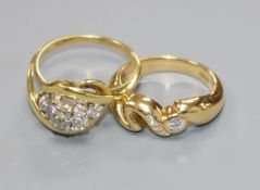Two modern 18ct gold and diamond dress rings including diamond cluster.