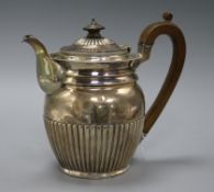 A George III demi fluted silver hot water pot, Robert Hennell II?, London 1810, 20cm, gross 20 oz.