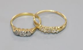 An 18ct gold and five stone diamond ring and an 18ct gold and illusion set three stone diamond