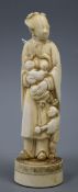 An early 19th century Chinese ivory group of mother and children H.18cm