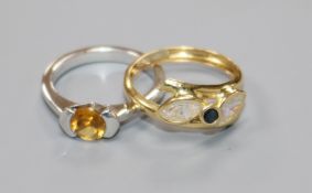 A modern 18ct white gold and citrine ring and an Italian 18ct gold ring.