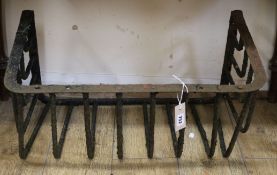 A wrought iron wall mounting hay rack W.67cm