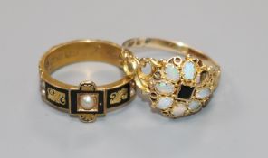 A late Victorian 15ct gold and black enamel mourning ring and an Edwardian 15ct gold, white opal and
