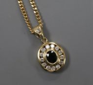An oval yellow metal, sapphire and diamond pendant on 9ct gold fine chain, pendant 11mm.