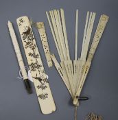 A Japanese ivory page turner, ivory umbrella handle and fan