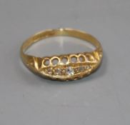An early 20th century 18ct gold and five stone diamond ring, size L/M