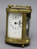 A 20th century oval brass carriage timepiece, the Roman dial marked Asprey London height 13cm - (