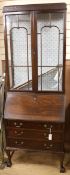 A 1920's George III style mahogany bureau bookcase W.75cm