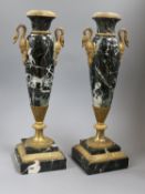 A pair of marble urns and mounts