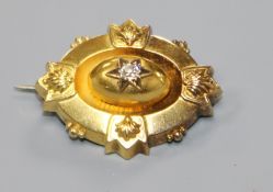 A Victorian yellow metal and diamond set oval brooch, 33mm.