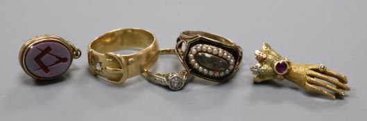 A George III yellow metal, seed pearl and enamel mourning ring, two diamond rings, a bloodstone