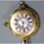 An 18ct gold and enamel half hunter manual wind wrist watch by Smith & Son, London, on a 9ct gold