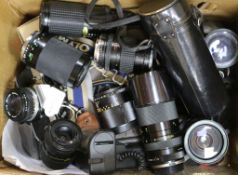 Four SLR cameras and various lenses, including Olympus OM10, OM2N and a Pentax P30T, etc