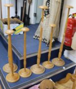 Six wooden hat stands W.23cm