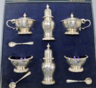 A cased 1950's/1960's six piece silver condiment set with three (ex 4) spoons, William Comyns & Sons