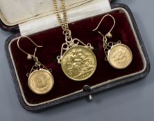 An Italian 9ct gold bracelet hung with a mounted gold half sovereign and a pair of yellow metal
