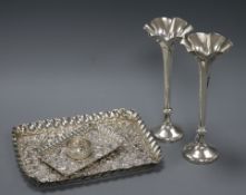 Two late 19th/early 20th century repousse silver trays, a pair of silver spill vases and a silver