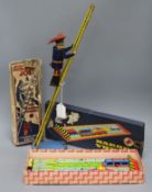 A Marx Smokey Joe climbing fireman tin plate toy and a Rakoda Vonat tin plate toy