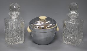 A pair of cut glass spirit decanters and a 1950's ice bucket