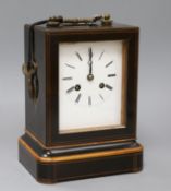 A line-inlaid boxwood and ebonised carriage clock, striking on bell, with white enamelled Roman