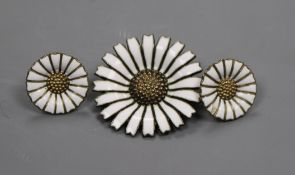 A Danish sterling silver flower brooch and a pair of unmarked similar earrings.