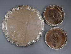 Two similar modern pierced silver bottle coasters and a silver salver, one coaster London 1978,