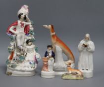 A Staffordshire figure of John Wesley and four other Staffordshire figures, including a Highland