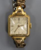 A lady's yellow metal Rolex manual wind wrist watch.