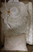 A collection of lace mats, nightie caes etc.