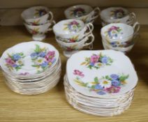 A Royal Albert Harvest-Bouquet pattern china tea service including ten tea cups, ten saucers and ten