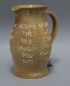 A Doulton Lambeth "The Landlord's Caution" stoneware beer jug