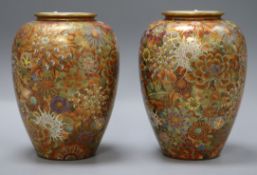 A pair of early 20th century Japanese Satsuma pottery vases with 'hundred flowers' decoration, H.