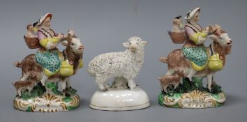 Two Staffordshire pottery figures of the tailor's wife and a figure of a sheep Tallest measures