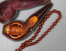 A Meerschaum pipe and bead necklace