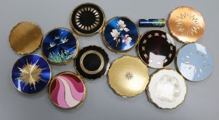 Twelve vintage Stratton powder compacts, including a blue enamelled flying ducks example with