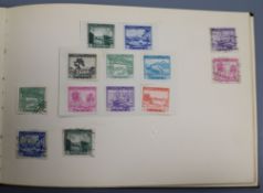 A Junior Edition 'International Postage Stamp Album' of World stamps and three other stamp albums,