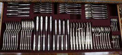 A mahogany cutlery cabinet, with the top drawer fitted with Queens pattern silver plated cutlery,