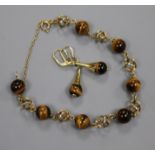 A 585 yellow metal and tiger's eye quartz bead bracelet and a pair of matching earrings.