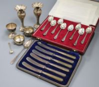 A cased set of eight 1970's silver picture back teaspoons by Mappin & Webb, a cased set of cake