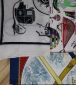 Three Hermes silk scarves,'Armes de Chasse', 'Les Folies du Ciel' and 'Carriages', designed