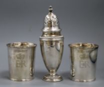 A pair of Tessiers Silver Jubilee beakers and a silver sugar caster, the beakers inscribed 'Here's