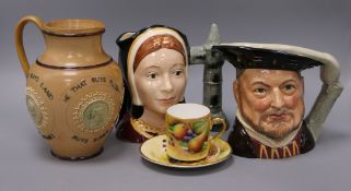 A Doulton stoneware jug, two Toby jugs and a Brookdale cup and saucer tallest 19.5cm