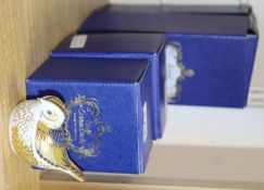 Four boxed Royal Crown Derby paperweights, including Otter, Ginger Cat, Seated Cat and Sleeping