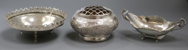 An Egyptian white metal oval two-handled bon bon dish, a Portuguese pierced white metal bowl and a