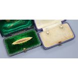 An early 20th century 9ct gold brooch and a pair of 18ct gold dress studs.